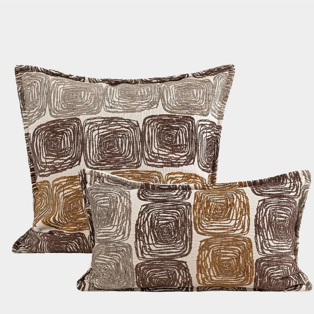 Abstract coil pattern pillow cover in cream and coffee colours showing square and rectangular size options