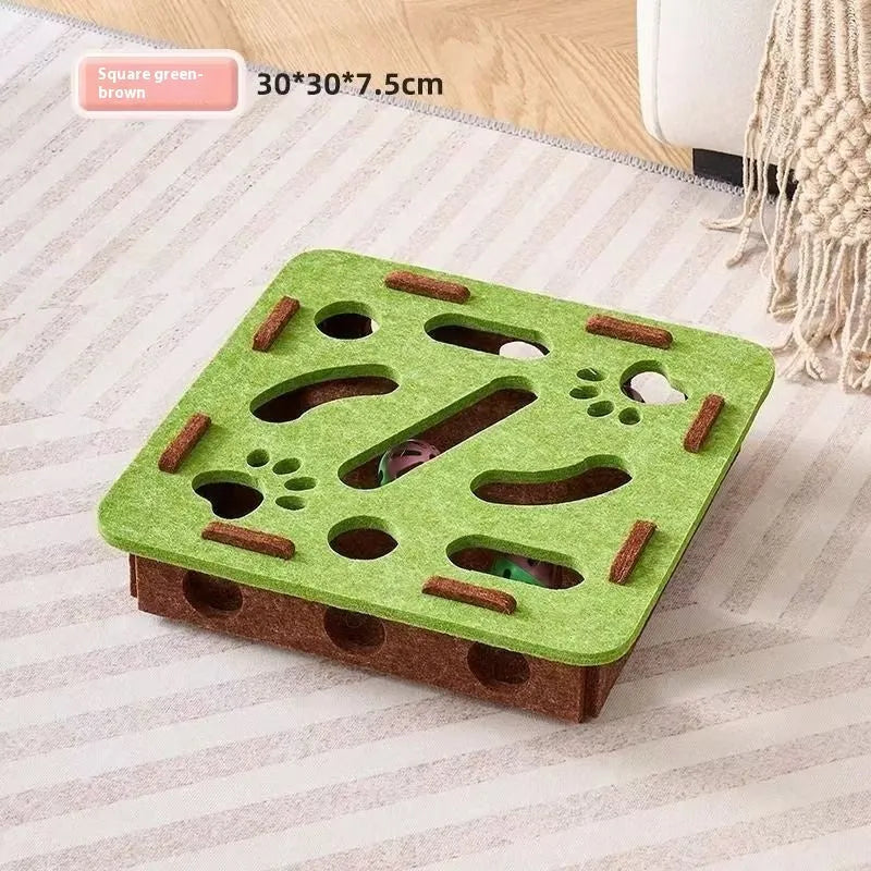 Square felt cat toy with artifact holes in green brown colour measuring 30cm