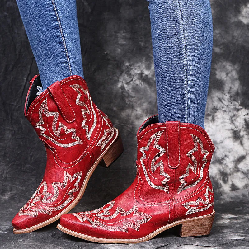 Women's blue embroidered cowboy boots with a wedge heel and pointed toe