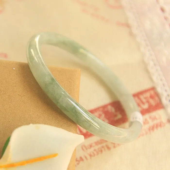 Green jade waxy geometric bracelet with Chinese style design and adjustable sizing