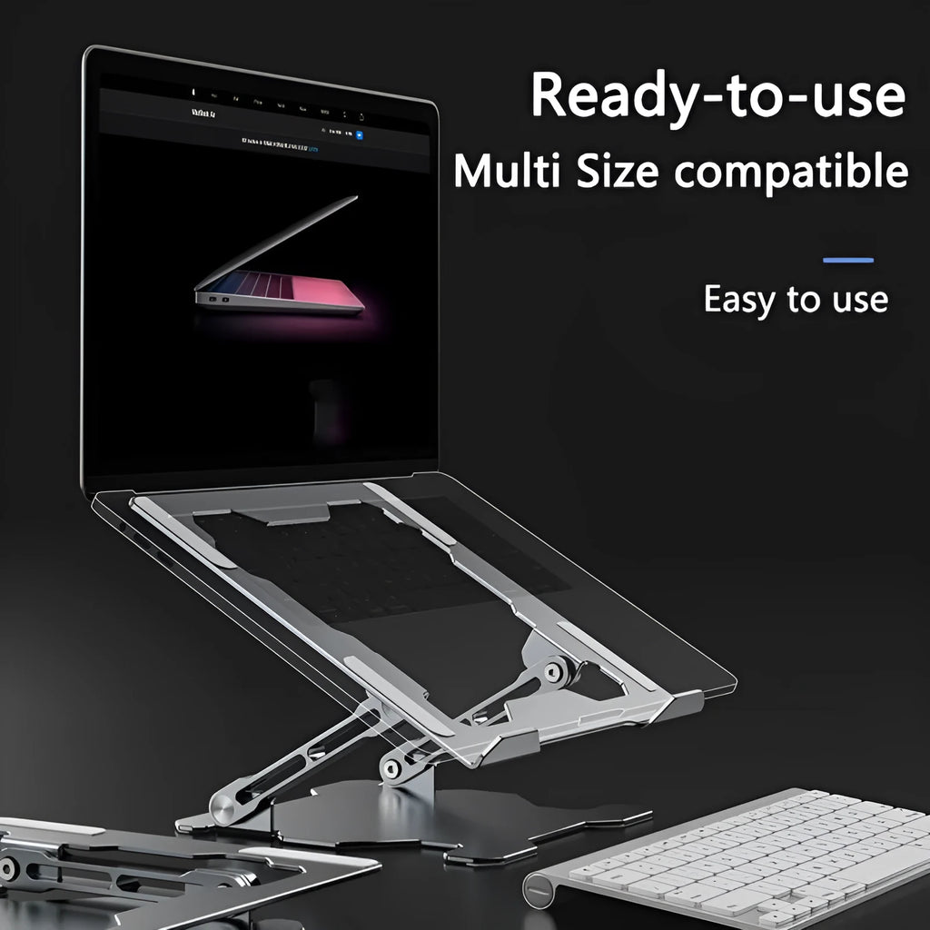 Grey aluminium folding laptop stand holding a silver laptop at an angle on a wooden desk.