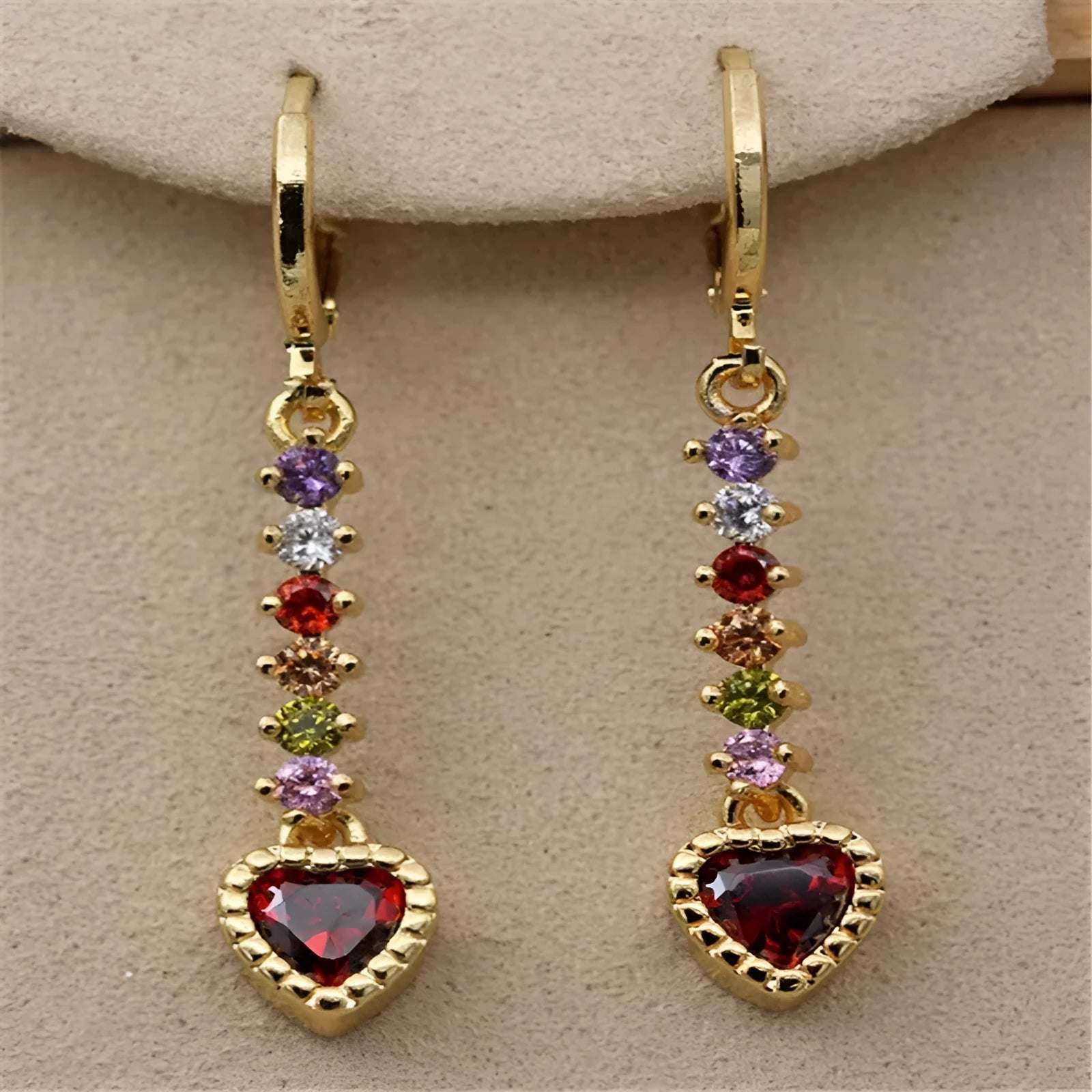 A pair of women's heart-shaped alloy earrings with an electroplated gold or silver finish.