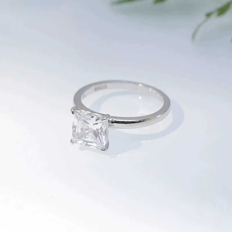 Simple geometric round sterling silver ring shown in silver, gold, and rose gold colour variations on a grey background.