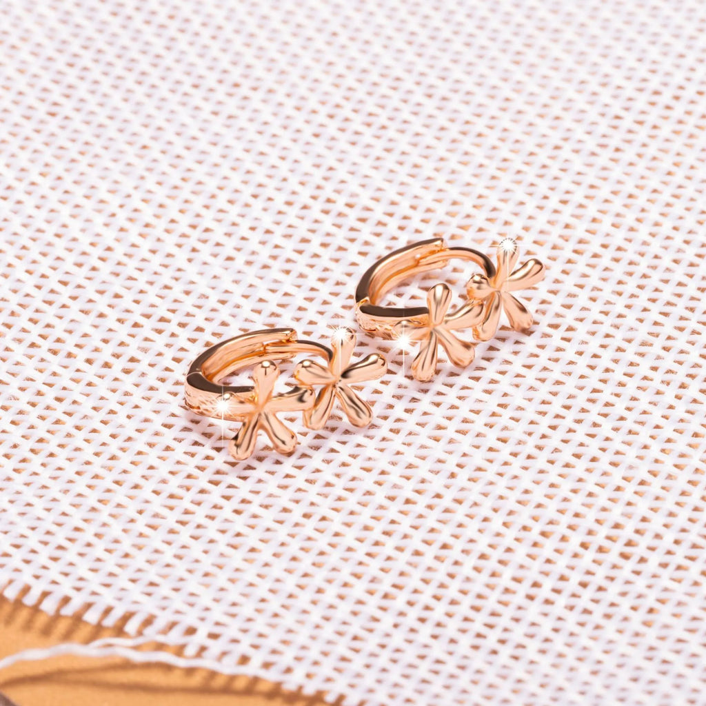 Rose gold circular stud earrings with a waterdrop flower design for women.