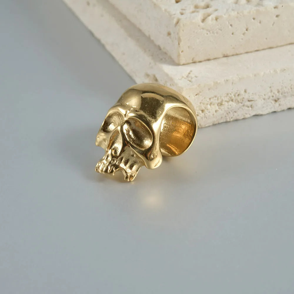 Stainless steel hollow geometric skull and Buddha head earrings with electroplated finish
