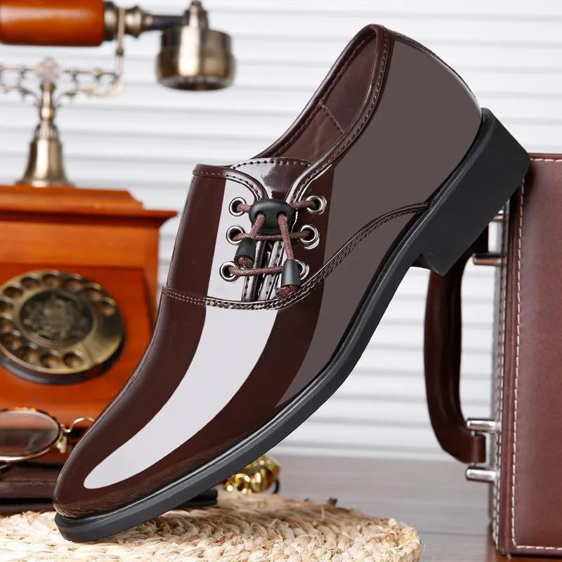 Men's black and brown formal business shoes with round toe and square heel on a rubber sole.