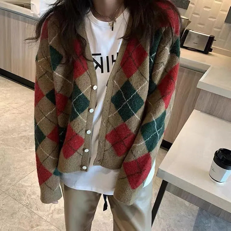 Casual pink knitted cardigan coat with regular sleeves, shown on a hanger.