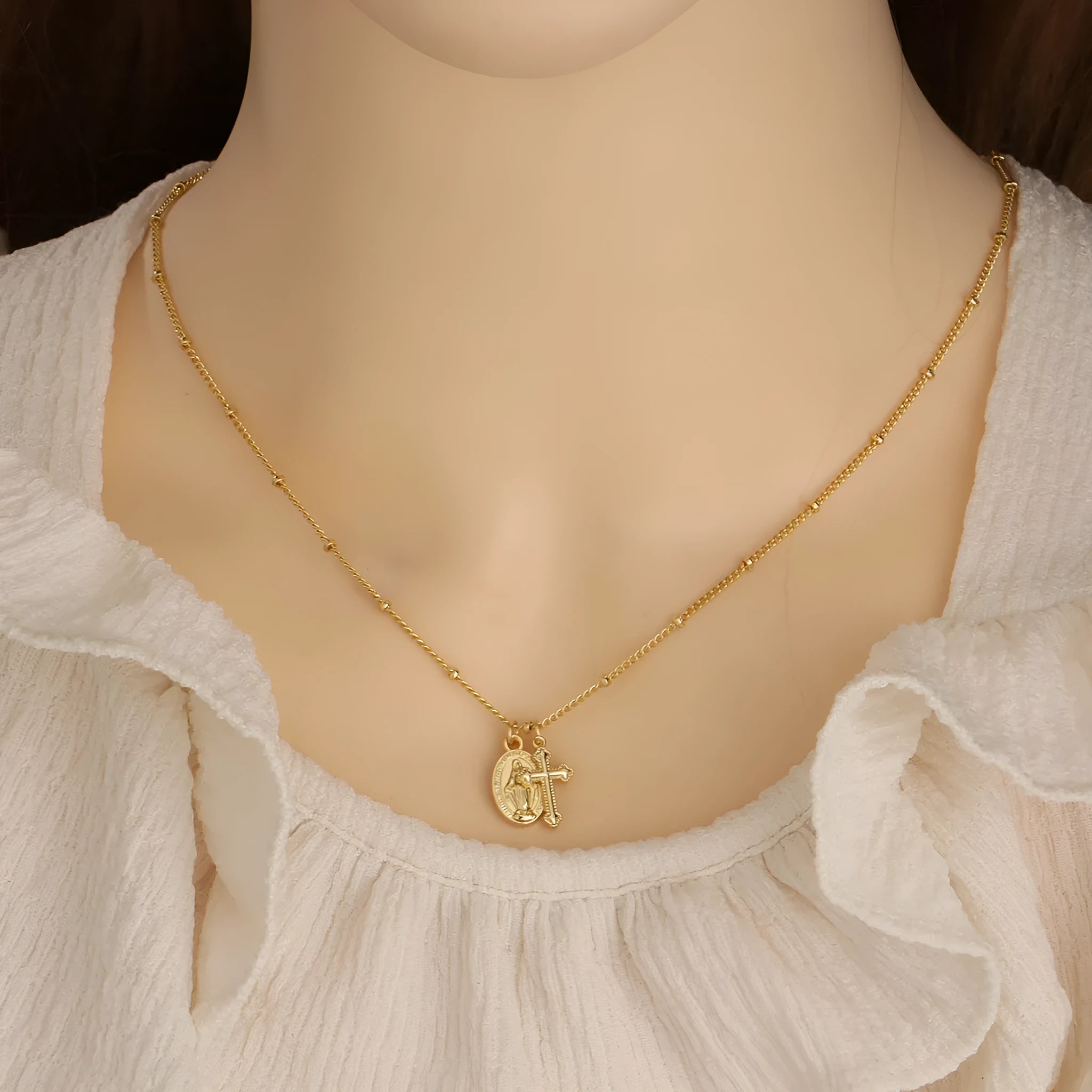 Gold Virgin Mary and cross geometric pendant necklace on a chain