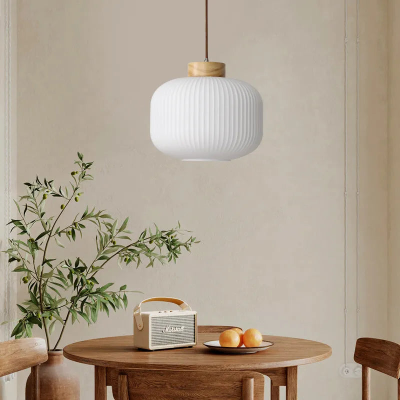 Nordic-style retro wooden pendant ceiling light with a natural wood finish, shown in a bedroom setting.