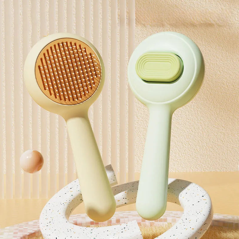 Green pet grooming brush with stainless steel comb pins and non-slip handle for cats and small dogs