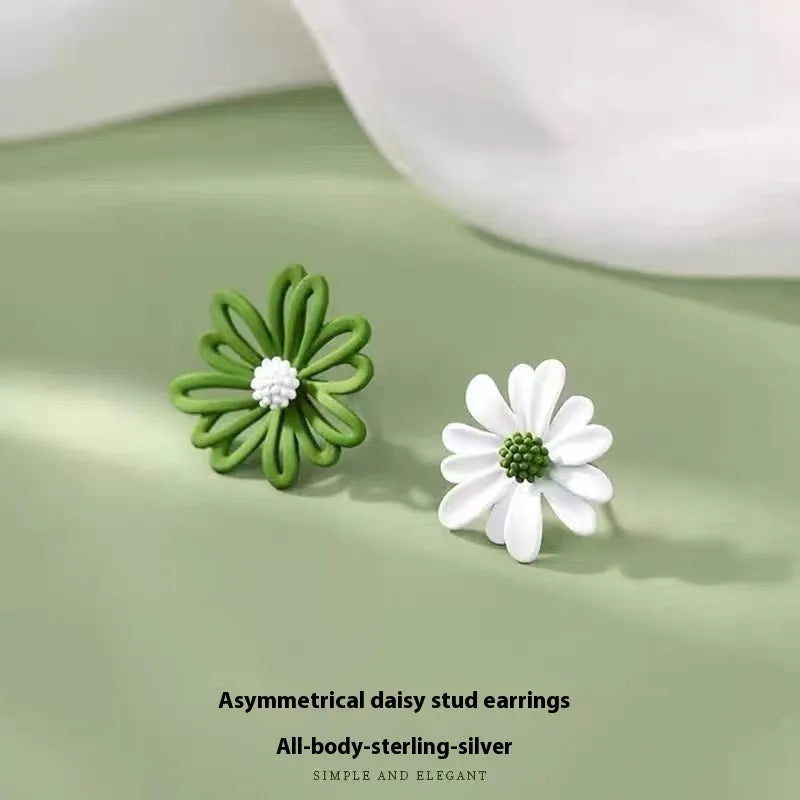 Cartoon style flower stud earrings made from alloy in blue and orange two-tone colours.