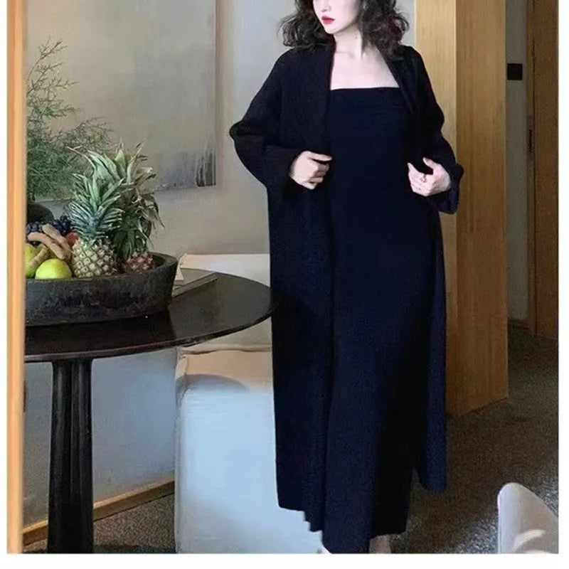 Women's grey knitted cardigan dress sweater suit two piece set with long skirt and regular sleeves.