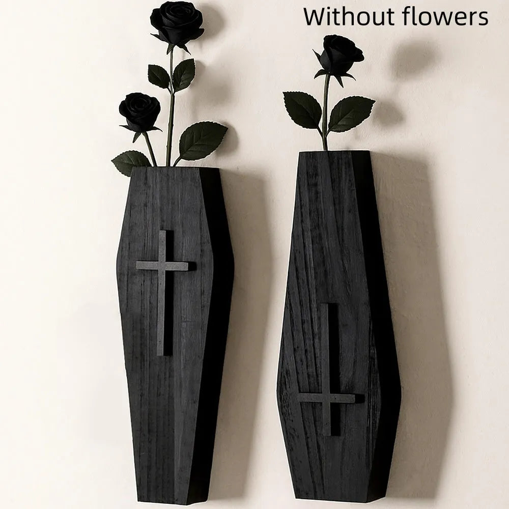 Black wooden cross-shaped wall shelf with a small ledge, measuring 27cm tall.