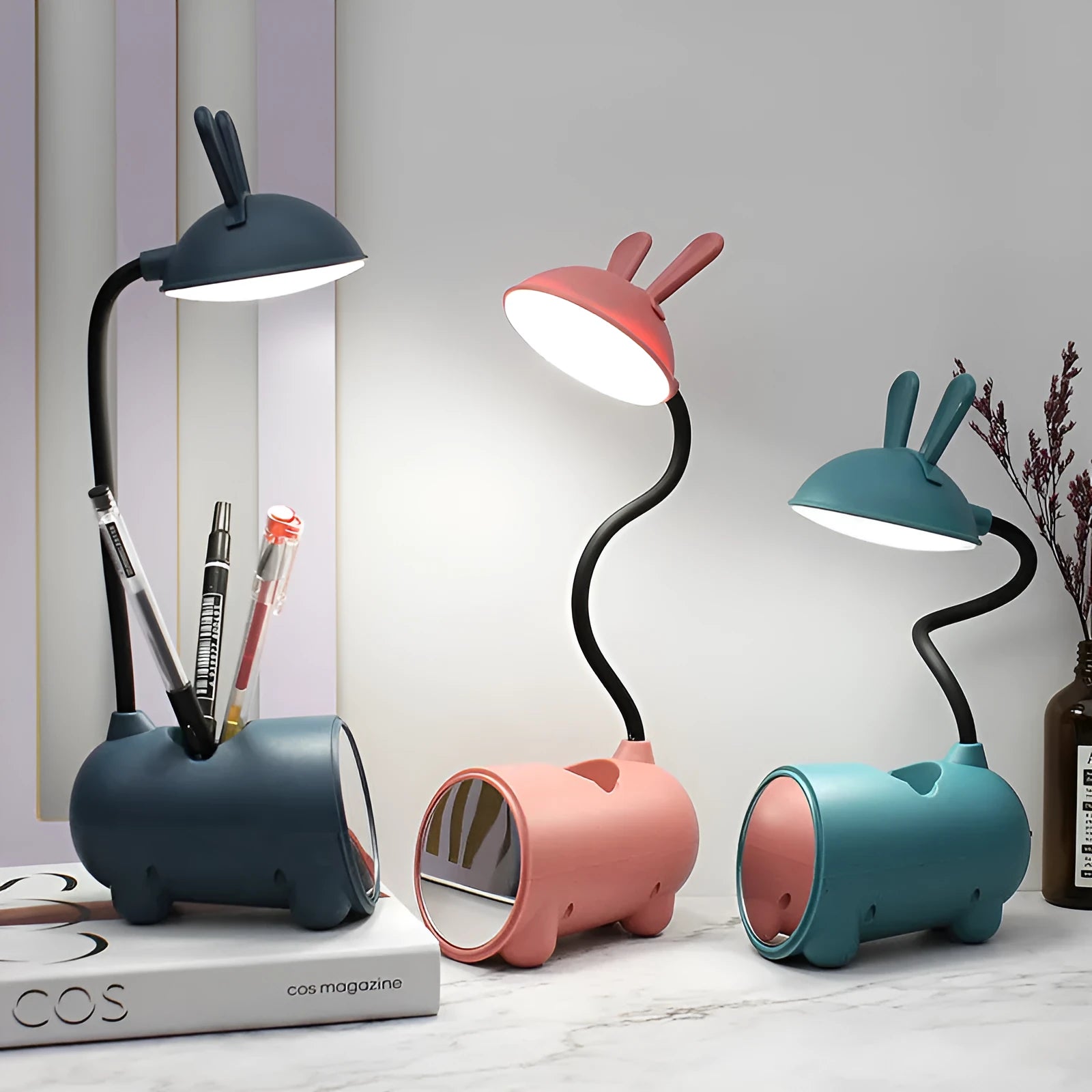 Green cartoon-themed USB table lamp with pen container base on desk