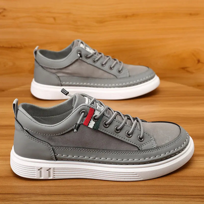 Men's high-cut canvas sneakers in grey, black, or green with a bandage dress style and round toe.