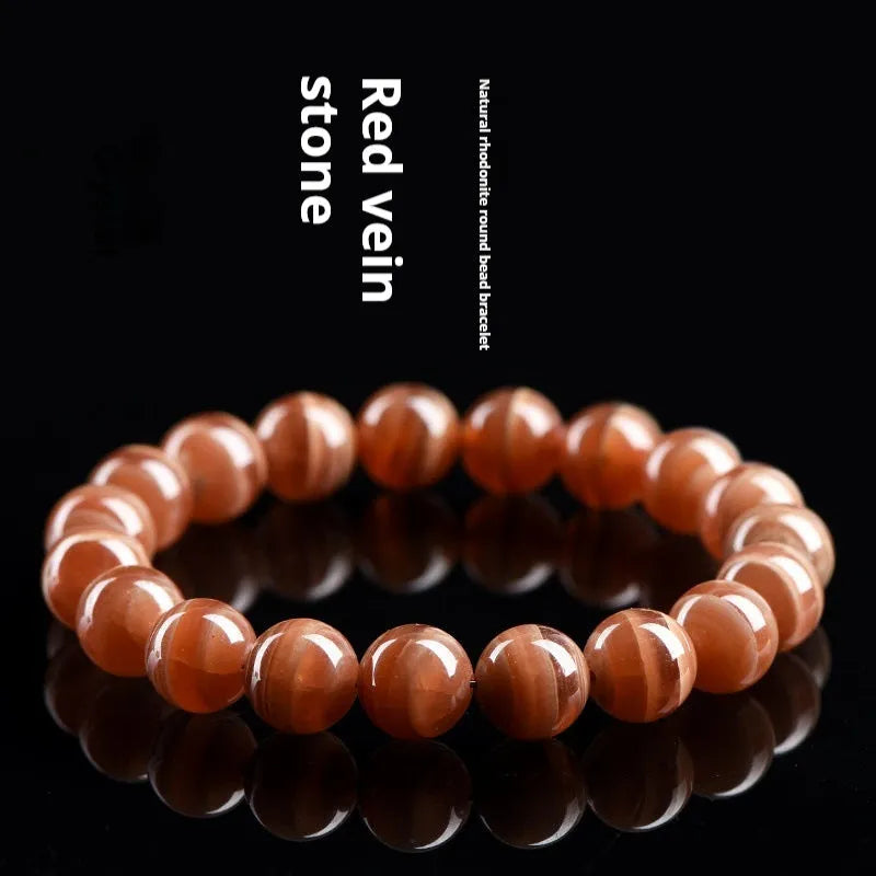 Natural rhodochrosite bracelet with round beads in old mine colour from Peru