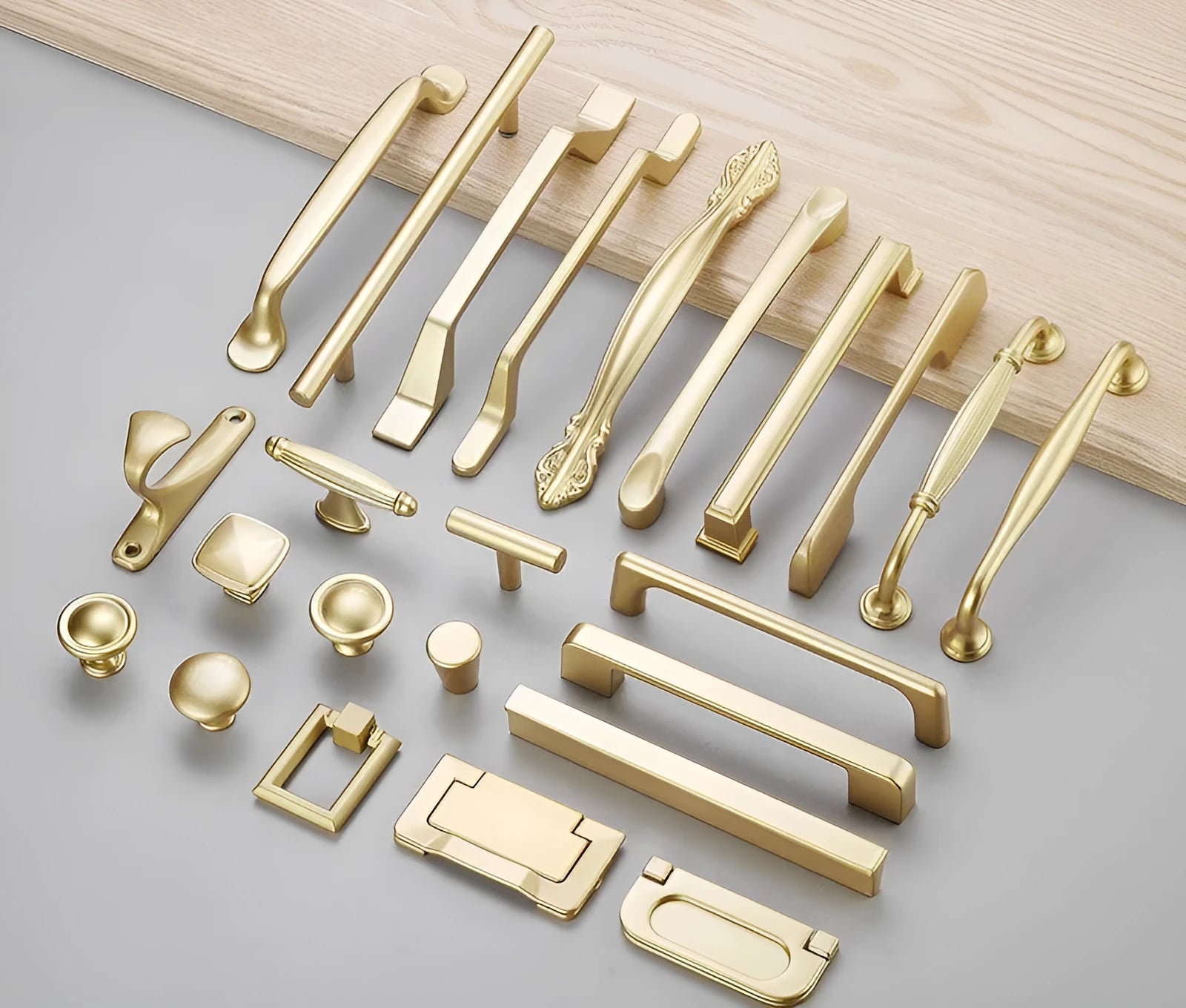 Gold T-shaped modern single hole cabinet drawer handle showing three size variants.