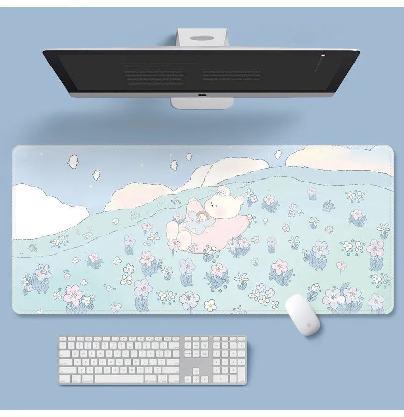 Large floral cartoon pattern mouse pad on a desk, showing non-slip rubber base and colourful design.