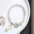 Handmade jade pearl bracelet with natural emerald peace buckle and geometric national style design