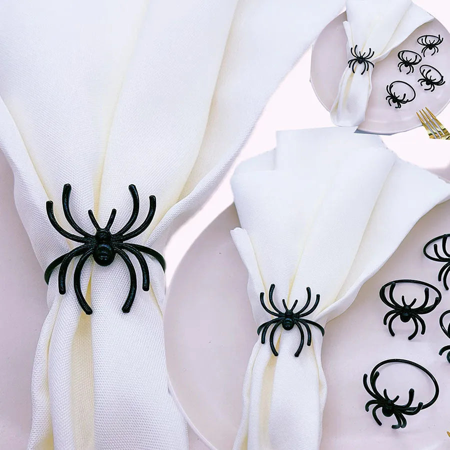 Set of six black alloy spider-shaped napkin rings for Halloween table decoration