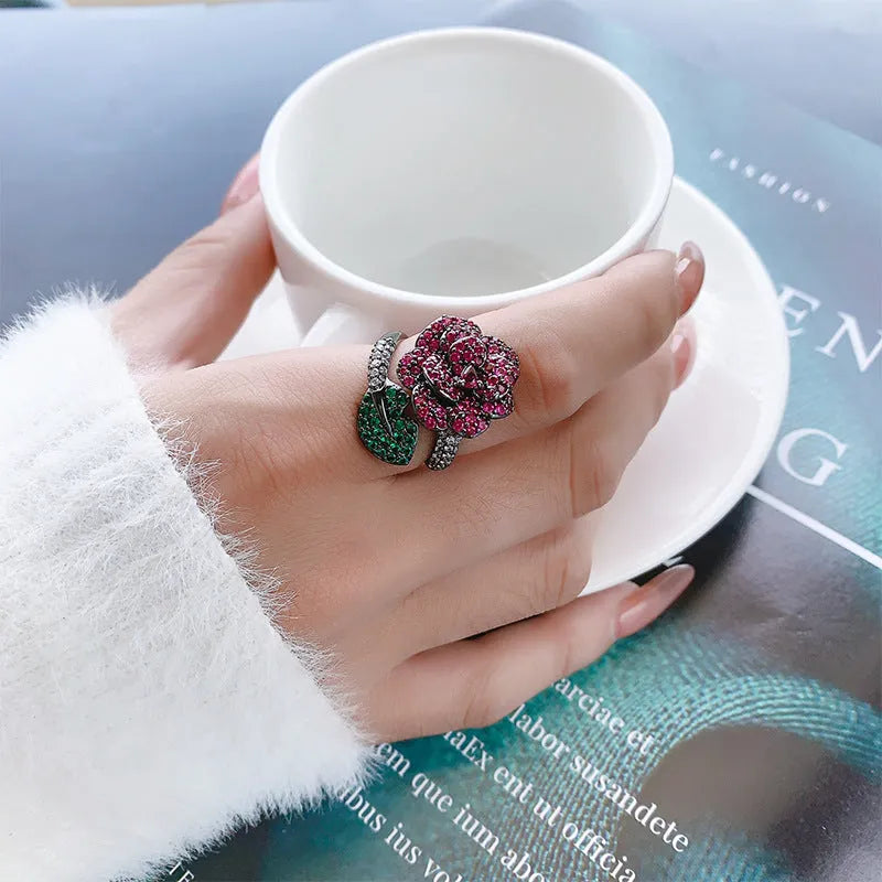 Black gold geometric flower ring with red simulation corundum stones