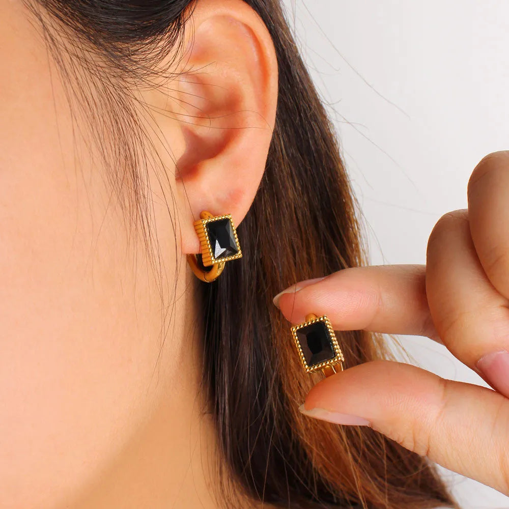 Square geometric design stainless steel earrings with zircon accents in white, black, and green colours.