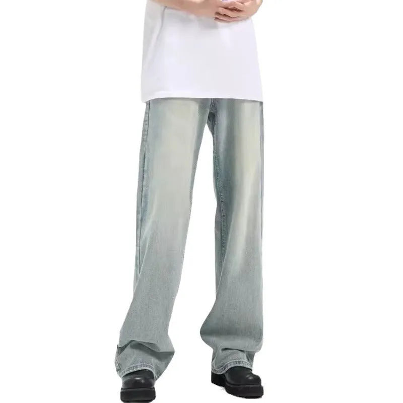 Blue loose-fit retro-style casual trousers with an elastic waistband on a hanger.