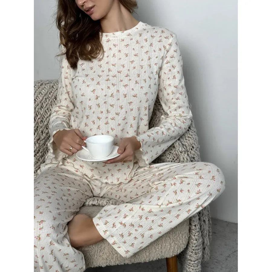White floral print women's loungewear set with bell sleeve top and wide-leg trousers