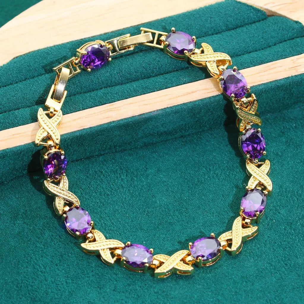 Gold plated cubic zirconia jewellery set showing necklace, earrings, ring, and bracelet with multi-colour stones