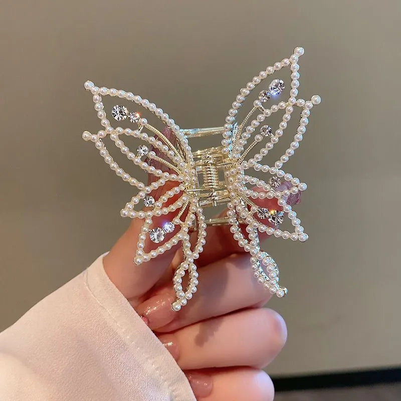 Butterfly-shaped hair clip with pearl or rhinestone decoration on alloy base