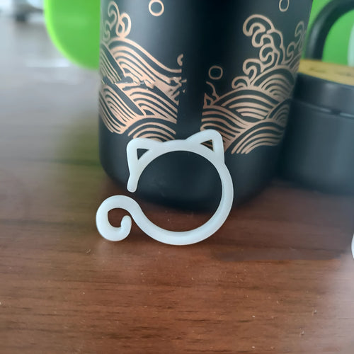 Cat-shaped plastic plant clip in green colour for garden stem support