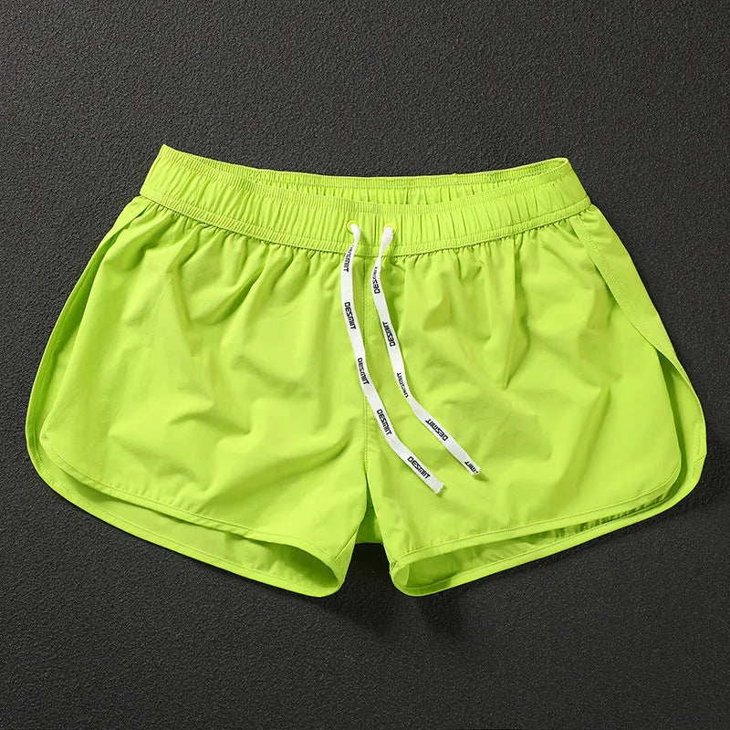 Men's loose beach surfing shorts in quick-dry polyester available in orange, green, and black