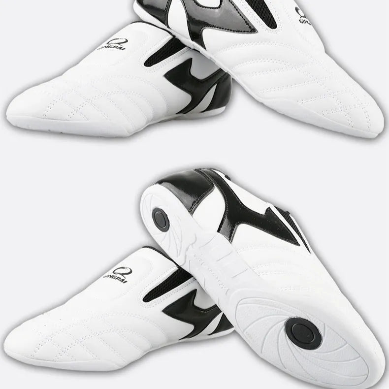 Black and white children's boxing shoes with soft bottom construction for martial arts training