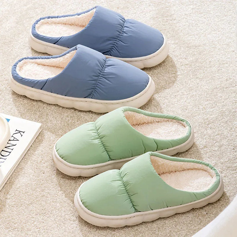 Blue winter slippers with artificial leather upper and thick rubber sole, showing plush lining.