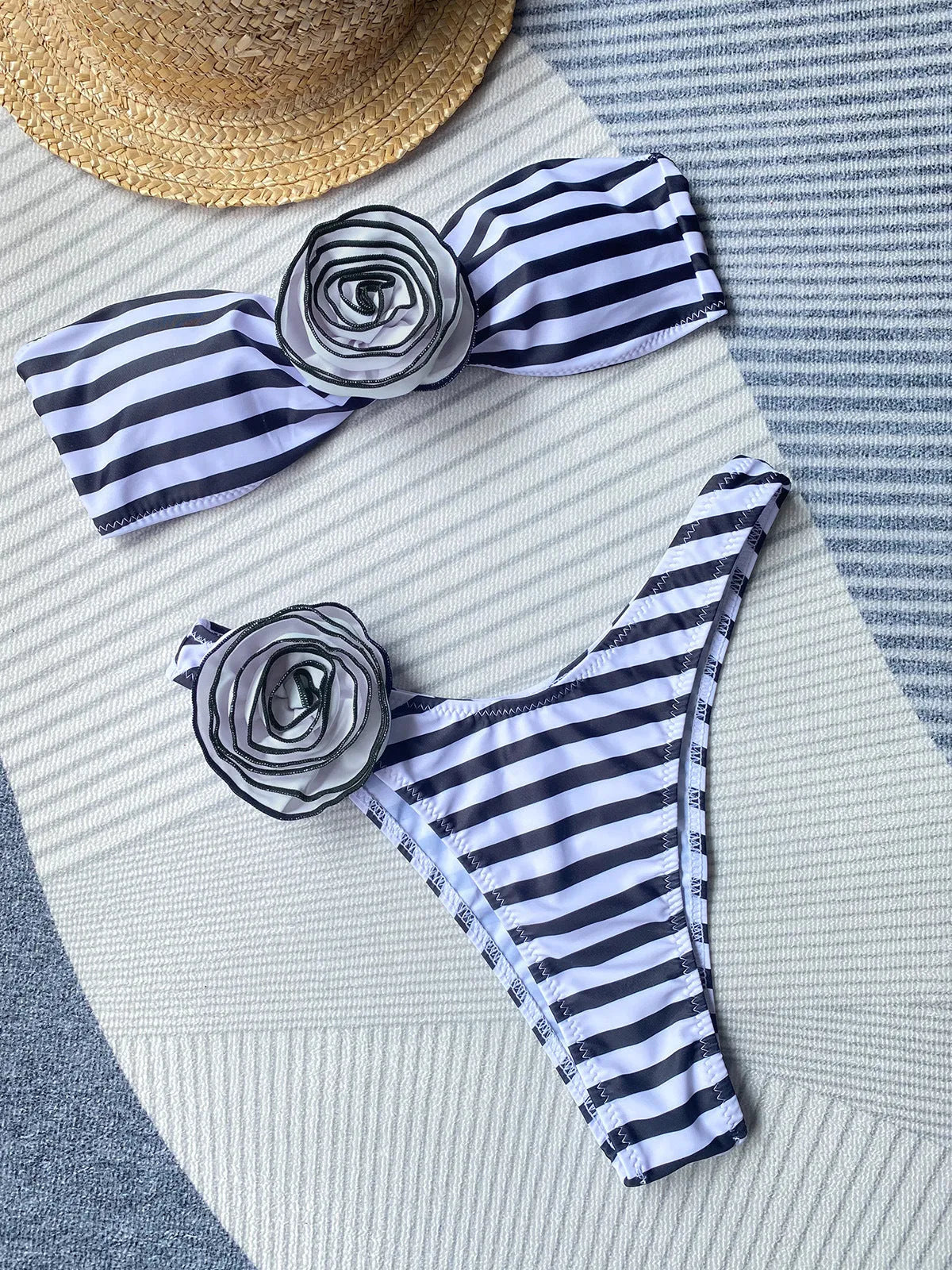 Striped bikini swimsuit set with a tube top, shorts, and a three-dimensional flower split design.