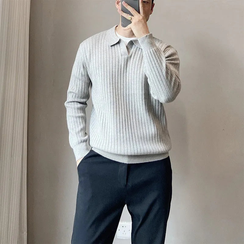 Man wearing a loose grey rabbit fur blend knitted pullover sweater, casual autumn style.