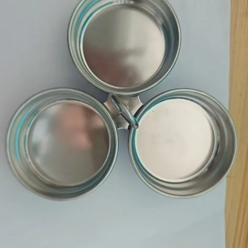 Mini stainless steel egg steamer in heart-shaped design with compact kitchen appliance dimensions