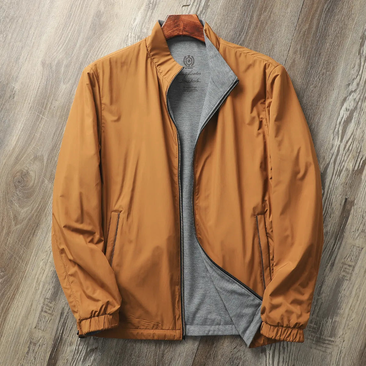 Men's simple stand collar casual jacket in polyester blend fabric, shown on a hanger.