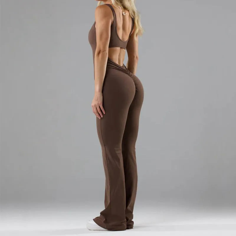Women's black milk silk yoga bodysuit with seamless hollow design and mid-waist fit.