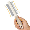 White 2 in 1 dog and cat grooming brush with curved comb and deshedding sides measuring 230mm