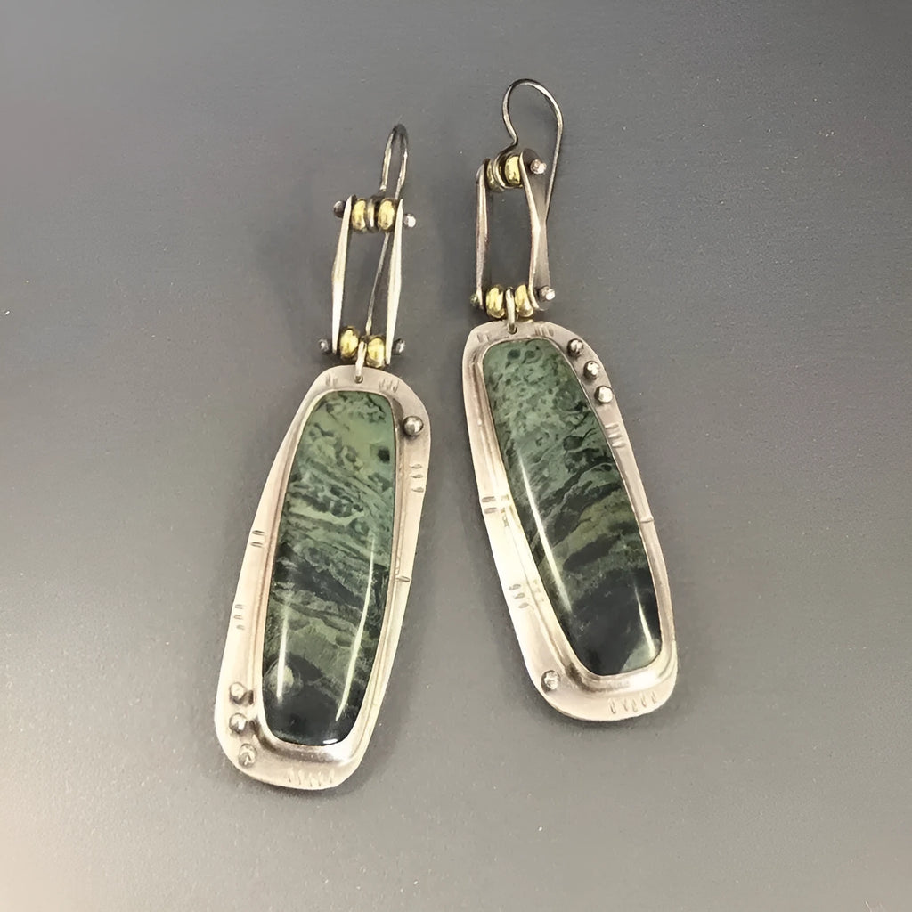 Geometric alloy earrings with black and white marble pattern showing front and side views