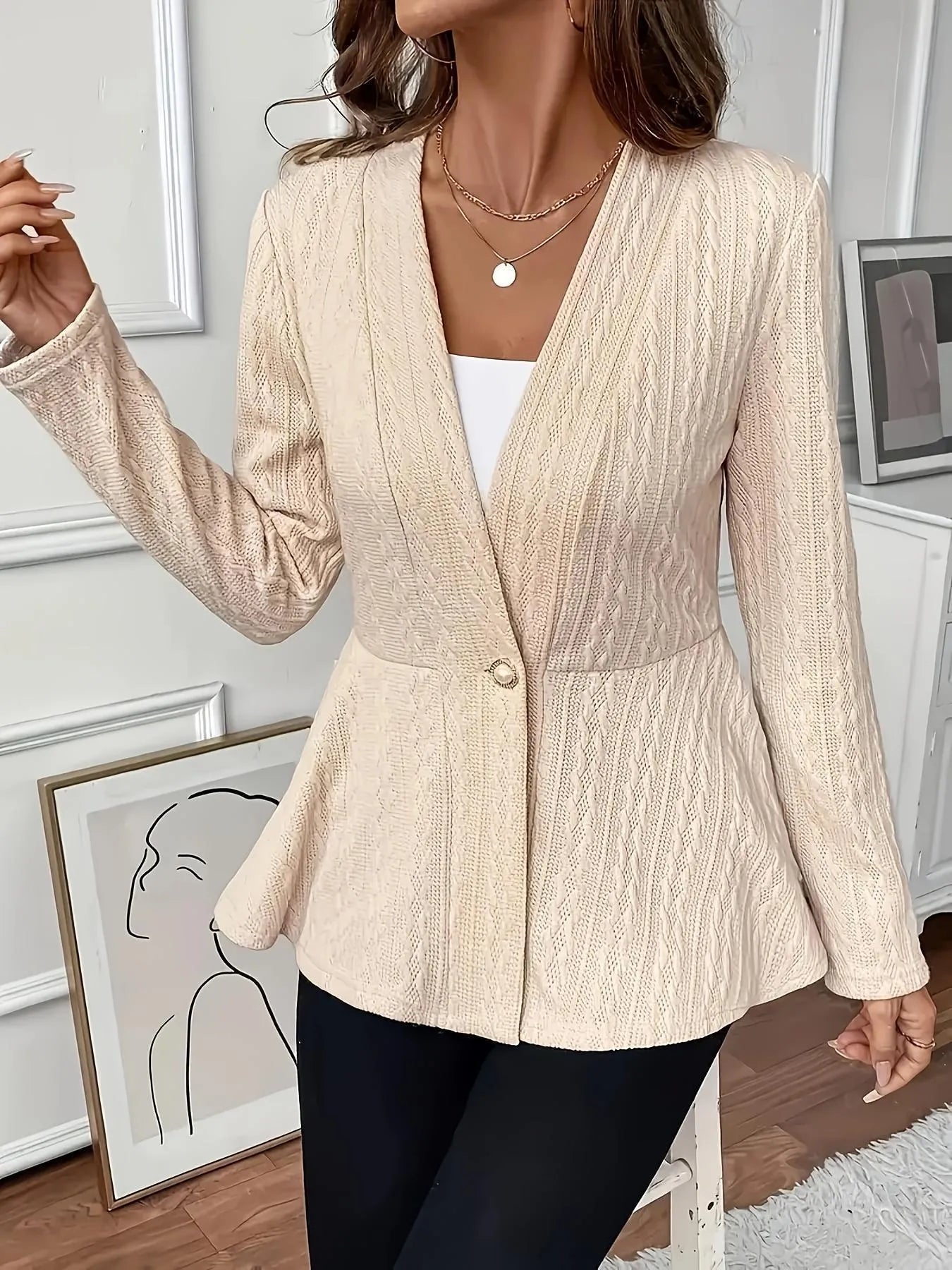 Women's apricot coloured tight fit knitted cardigan with jacquard pattern and one button front