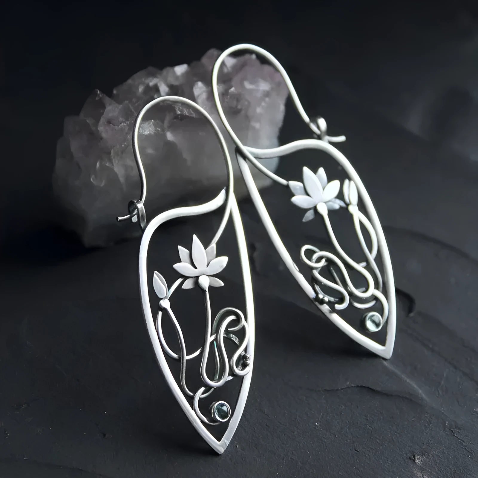 Silver lotus flower earrings with geometric shapes and rhinestone details