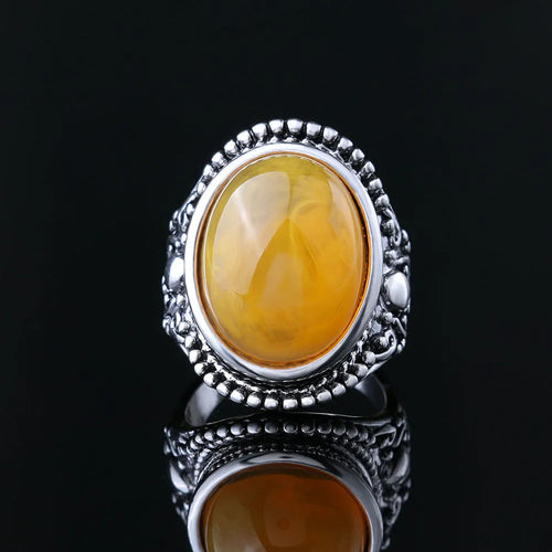Retro geometric alloy ring with fluorescent beeswax centre and antique silver electroplated finish
