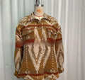 Women's loose-fit retro coat with blue Aztec print and long sleeves.