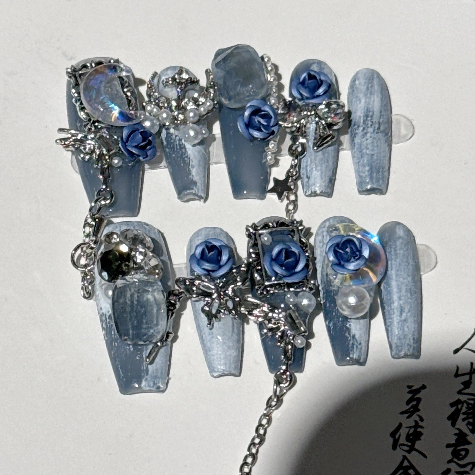 Heavy industry night blue press-on nails with ornate rose and tulip patterns in four sizes XS to L