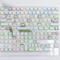 PBT sublimation key cap set showing colourful cat and puppy character designs on mechanical keyboard keys
