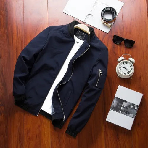 Men's slim fit casual jacket in a solid colour with a stand collar and side zippered pockets.