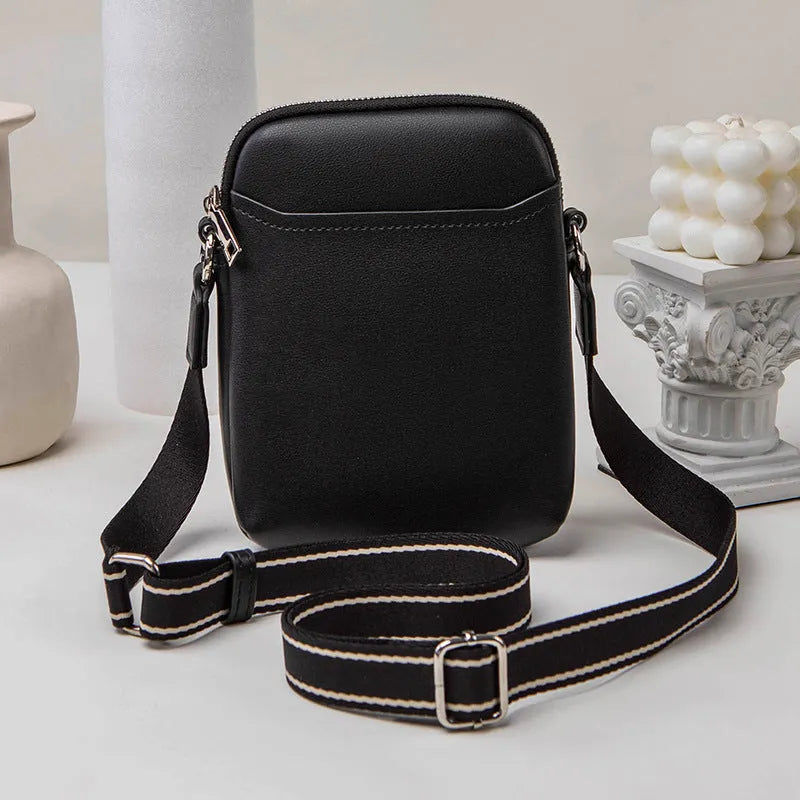 Solid colour PU leather crossbody phone bag for women shown in beige.