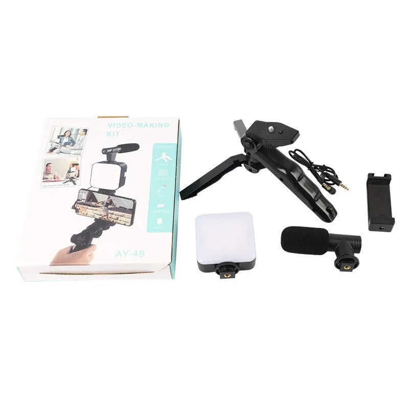 LED mini square universal camera flash on a pocket tripod, showing compact size and rotatable flash head.